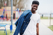 © AS Photo Family - Young millennial african boy in city. Happy black man in jeans jacket. Generation Z concept.