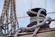 A Self-tailing Winch Of A Sailing Boat With Rope Over It.