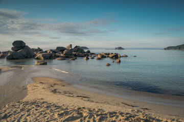 Poster - large boulders in the sea at sunrise