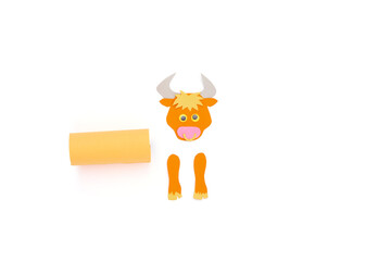 Wall Mural - ox or bull toilet paper roll craft concept for kid and kindergarten, year of the ox, how to make bull, step by step instruction, tutorial, DIY, project step2, glue rectangular piece to tube, assambley