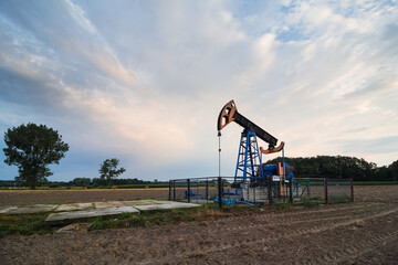 oil mine at sunrise.