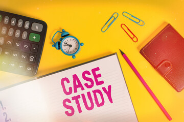 Handwriting text Case Study. Conceptual photo indepth examination method focusing on a single individual Open notebook wallet calculator clips pencil alarm clock color background