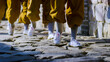 A group of children monks training kungfu in Shaolin Monastery walking. Dengfeng, Zhengzhou, Henan, China
