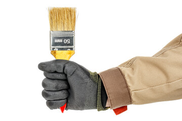 Wall Mural - Paintbrush in worker hand in black protective glove and brown uniform isolated on white background