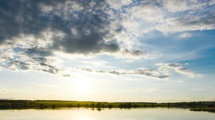 Wall Mural - Timelapse of the sunset over the lake in fine summer weather