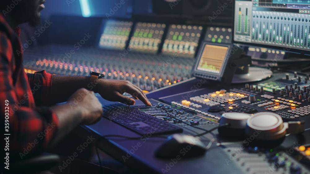 Energetic Male Audio Engineer / Producer Working in Music Recording ...