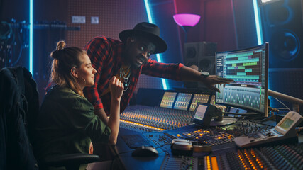 Poster - Producer and Professional Audio Engineer Working together in Music Recording Studio on a New Album, Talk, Use Control Desk Equalizer, Mixing Board and Software to Create Hit Song. Artist and Musician