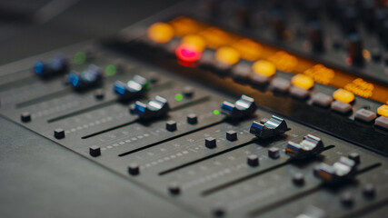 Fototapete - Modern Music Record Studio Control Desk with Automatic Equalizer, Mixer and other Professional Equipment. Switchers, Buttons, Faders, Sliders, Motorized Faders Move, Record, Play Hit Song. Close-up 