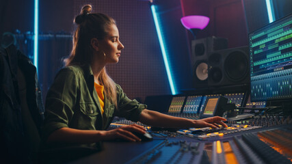 Fototapete - Female Audio Engineer Working in Music Recording Studio, Uses Mixing Board Create Song. Successful Girl Artist Musician Working at Control Desk. Having Fun, Smiling.