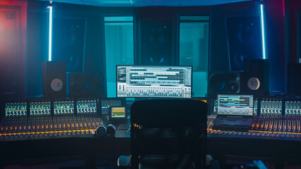 shot of a modern music record studio control desk with computer screen show user interface of daw so