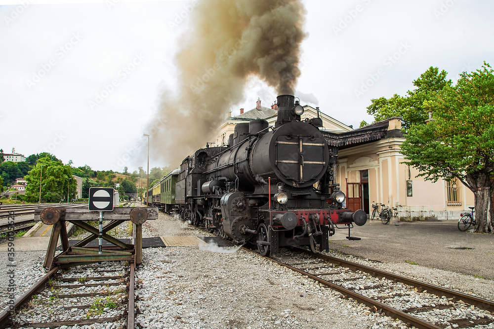 Old steam train at the train station of Most na Soci, Slovenia - obrazy, fototapety, plakaty 
