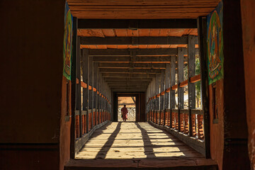 Wall Mural - Monk walking towards Dzong, Paro, Bhutan