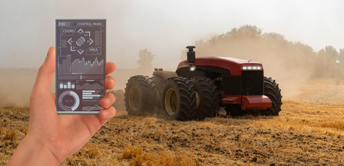 Autocollant - A farmer controls an autonomous tractor through a smartphone mobile application