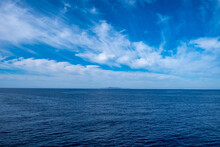 Blue Sea And Sky Background, Blue Shades And White Clouds