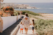 Family go to sea beach. Mother and her daughters on summer vacation. rest in Cyprus . High quality photo