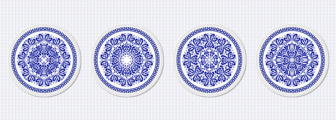Set of four plates with a stylized blue floral pattern made in Russian folk style Gzhel
