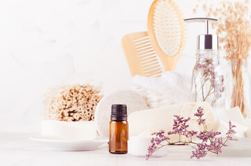 Wall Mural - Fresh clean white cosmetic product and natural beauty accessories for skin cleansing, body care with violet dry flowers on white wood table, closeup.