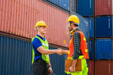 Engineer and foreman worker handshake with blurred construction site, Success and Teamwork concept