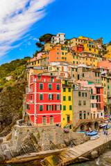 Wall Mural - It's Beautiful view of Riomaggiore (Rimazuu), a village in province of La Spezia, Liguria, Italy. It's one of the lands of Cinque Terre, UNESCO World Heritage Site