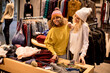 © BGStock72 - Two young women choosing winter clothes