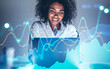 © ImageFlow - Smiling African woman in office, financial chart