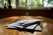 © Andrius - Envelopes on the wooden table during sunny day