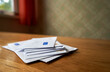 © Andrius - Stack of envelopes on the wooden table