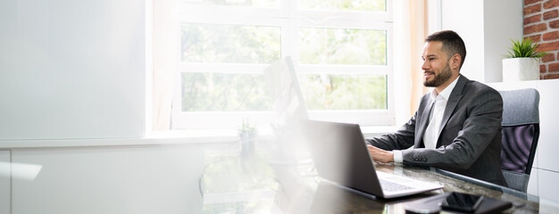 employee looking at computer screen