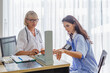 © eakgrungenerd - Senior doctor women is measuring patient pressure in examination room of hospital.