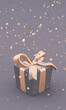 Beautiful gift box with golden bow and ribbons on grey background, falling confetti. 3D illustration. Vertical poster.