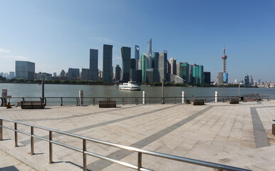 Empty road surface floor with city landmark buildings of Shanghai Skyline