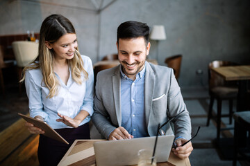 Business people having fun and chatting at workplace office