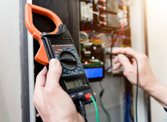 Poster - The man is repairing the switchboard voltage with automatic switches.