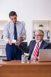 © Elnur - Old boss and young male employee in the office