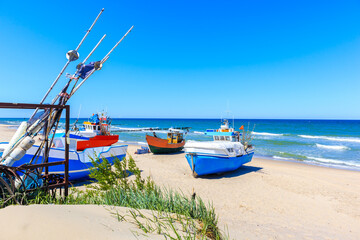 Wall Mural - Fishing boats on sandy beach in Chlopy village port, Baltic Sea coast, Poland