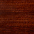 Varnished red tree with original texture. Beautiful brown wood background on lacquered textured plywood.