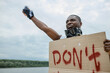 © alfa27 - Activist holding cardboard sign