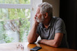 Senior retired man sitting at home alone while quarantine