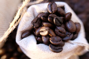 Sticker - close up coffee beans and macro coffee beans on wood table 