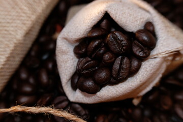 Poster - close up coffee beans and macro coffee beans on wood table background