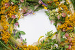 Beautiful wreath of wild flowers , typical Scandinavian midsummer decoration concept. Pink background. Top view