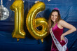 © Mat Hayward - 16 year old girl poses for a photo near her birthday party decorations