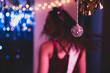 © Mat Hayward - Girl dancing at a party with a disco ball