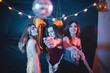 © Mat Hayward - Group of three girls dancing and having fun at a birthday party with a disco ball