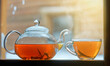 Tea pot with tea leaves.