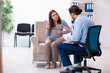 © Elnur - Pregnant woman visiting young male psychologist