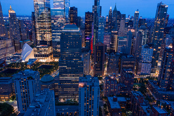 Wall Mural - Aerial view of New York City skyline at sunset with both midtown, WTC, and downtown Manhattan