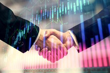 Double exposure of forex graph hologram and handshake of two men. Stock market concept.