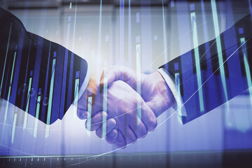 Double exposure of forex graph hologram and handshake of two men. Stock market concept.