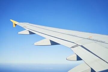 Cloudscape from window airplane, landscape of wing plane on a cloudy sky